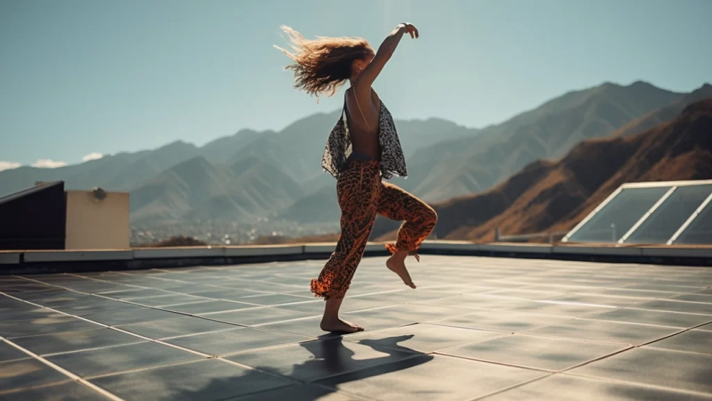 Woman dancing on roof with solar panels