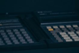 two calculators in a dark environment